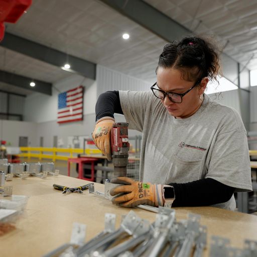 woman working with hand drill