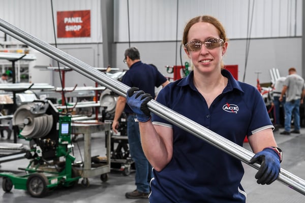 Ace Electric team member bending pipe