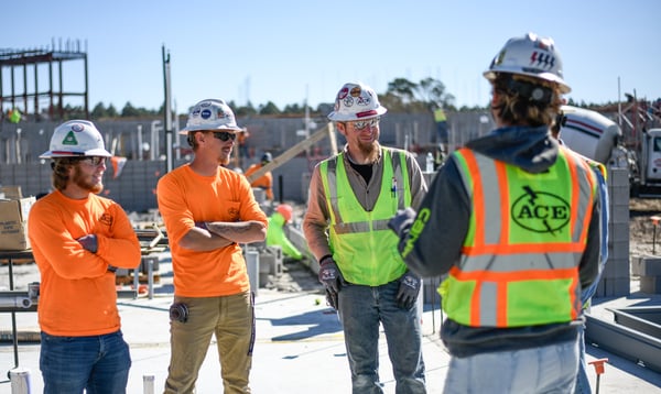 Electricians talking on a job site
